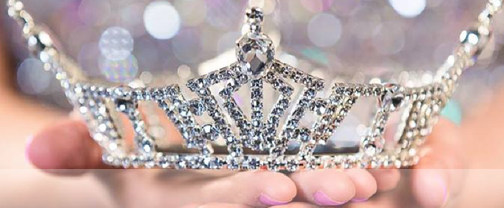 Hands holding a crown.